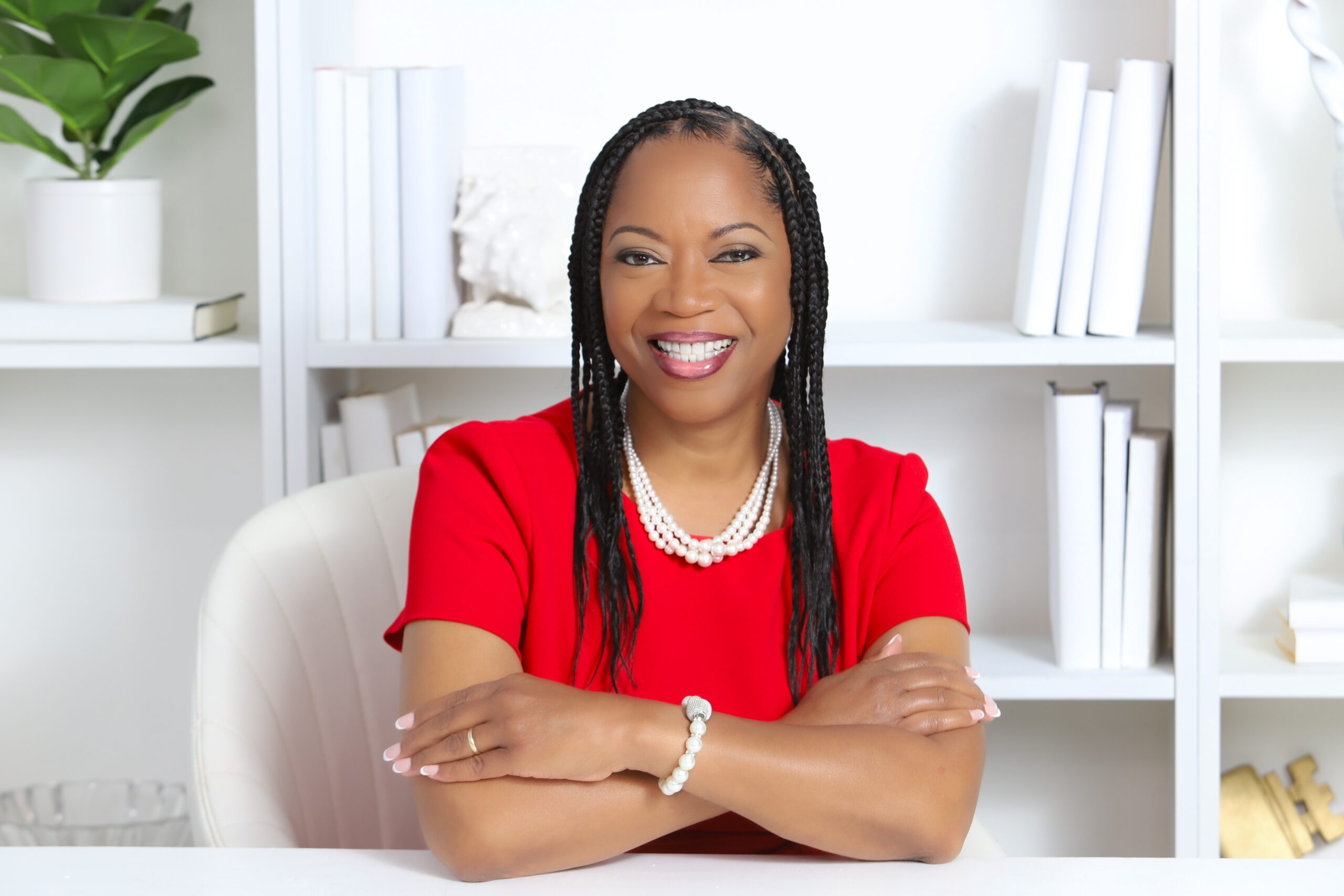 Dinah Rainey smiling at her desk