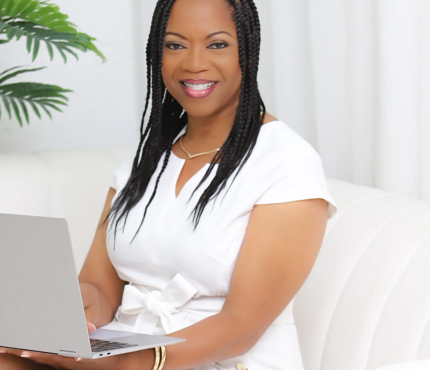 Dinah Rainey reviewing an application on her laptop